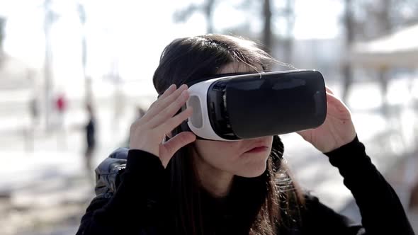 Serious Woman in VR Headset on Street