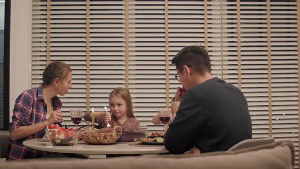 Family dining together in evening