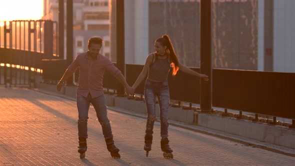 Smiling Couple on Rollerblades.