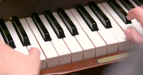 Man practicing piano at home