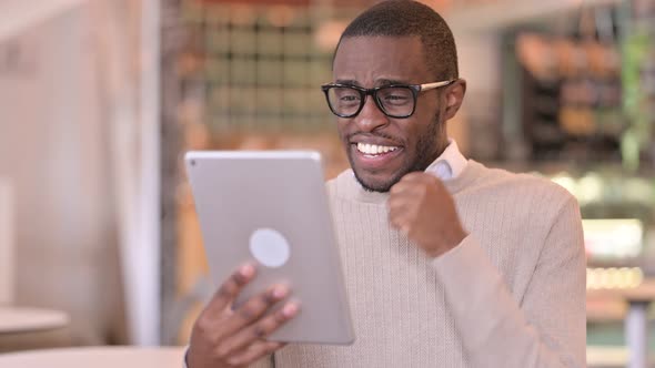 Portrait of Disappointed African Man Having Loss on Tablet 