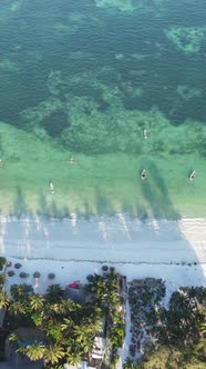 Boat Boats in the Ocean Near the Coast of Zanzibar Tanzania Slow Motion Vertical Video