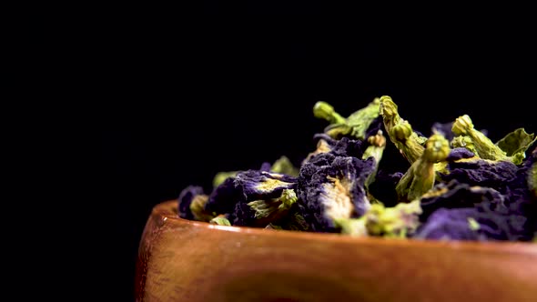 Chang shu dry butterfly flower tea. Blue dried Clitoria ternatea in wooden bowl