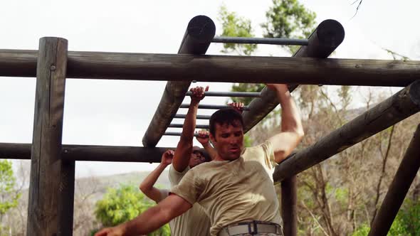 Military soldiers climbing monkey bars 4k