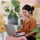 Happy young Asian woman enjoy to shopping from online shopping platform by laptop computer. - VideoHive Item for Sale