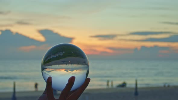 Hold A Crystal Ball In Sunset