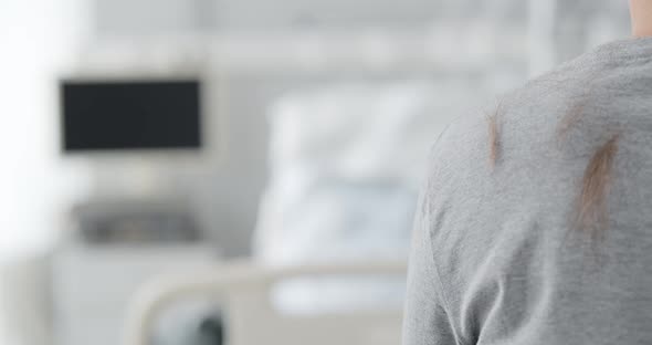 Cropped Shot of Patient Having Hair Shaven in Hospital Before Surgery