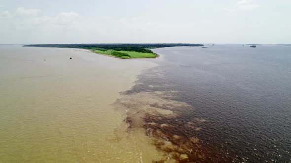 The Confluence of Two Dark and Light Waters of the Encontro Das Aguas and Rio Negro Straits