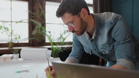 Architect Working on Blueprint with Spesial Tools and Pencil, Close Up, Male Architect at Work, Only