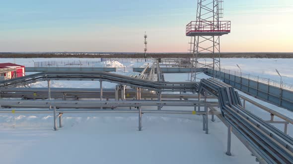 A Drone Flies Over a Pipeline a Gas Pipeline at an Oil and Gas Field in Siberia