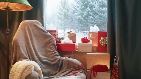 Christmas Background with Stack of Holiday Gifts Mountain Cabin Window Snowfall alt