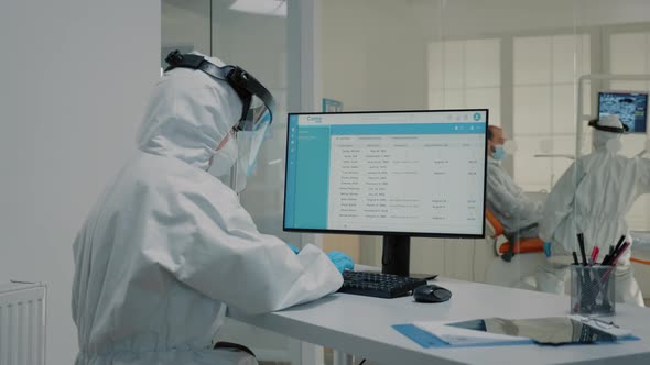 Dental Assistant Working on Computer at Dentistry Clinic