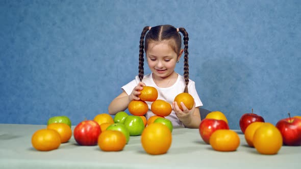 Cute little girl with fresh fruit
