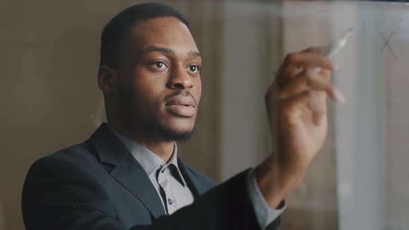 Portrait of Afro American Business Man Employee Standing in Office Writing with Marker on