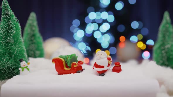 Toy Santa Claus on the Background of Light Bulbs