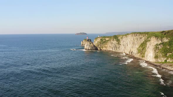 Basargin Lighthouse on a Rocky Island with a Suspension Bridge to It