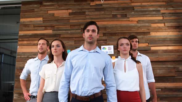 Group of business executives walking in office