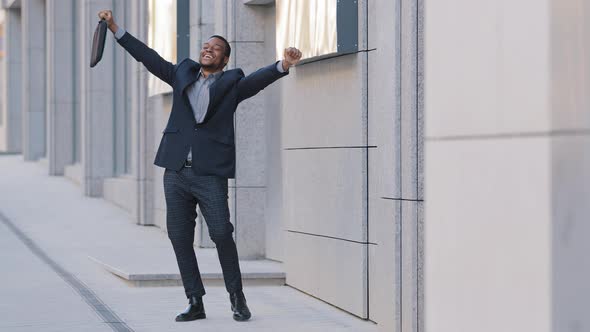 Happy Funny Young Businessman Dancing Alone Outdoors Celebrating Friday Work Achievement