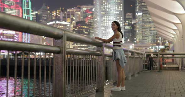 Woman visit Hong Kong and looking far away in Hong Kong