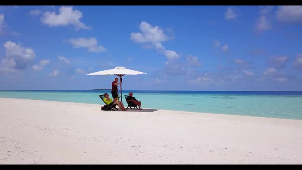 Romantic couple relax on marine sea view beach journey by blue green water with clean sand backgroun