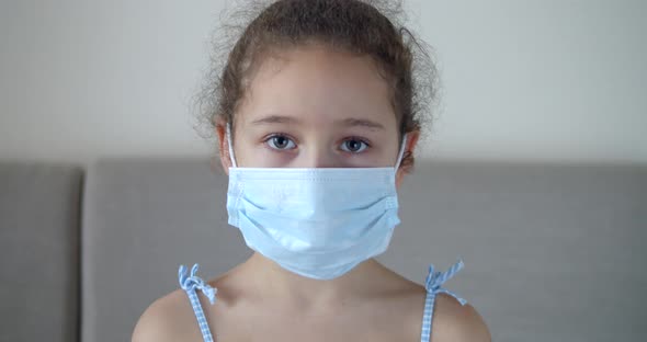 Portrait Cute Child or Little Girl in a Medical Mask