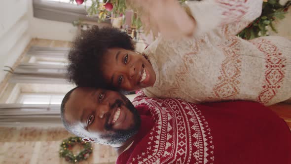 Joyous Afro-American Couple Chatting on Video Call on Christmas