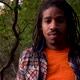 Portrait Young Black Man Looking At Camera While in Forest - VideoHive Item for Sale
