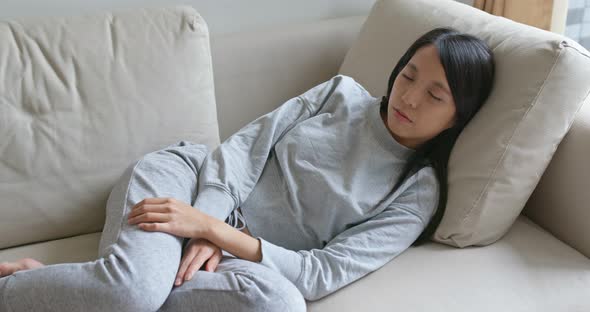 Woman sleep on sofa at home