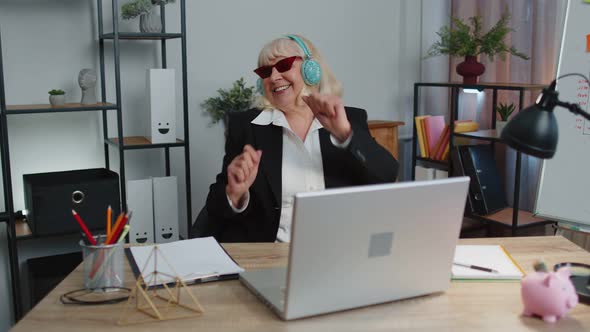 Happy Senior Business Woman Dancing Victory Dance Celebrating Weekend Holiday Success Win in Office