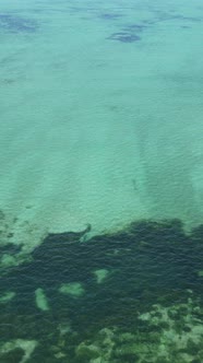 Boat Boats in the Ocean Near the Coast of Zanzibar Tanzania Slow Motion Vertical Video