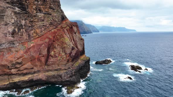 Drone flight along dramatic promontory on scenic Madeira coastline, Portugal