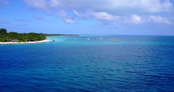 Luxury fly over copy space shot of a summer white paradise sand beach and blue sea background in hi 