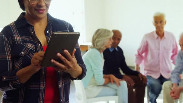 Woman using digital tablet at health center