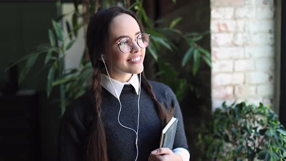 Portrait of Smiling Girl Looking at Camera