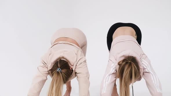 Cute athletic Women do push-UPS. Strength training in quarantine.