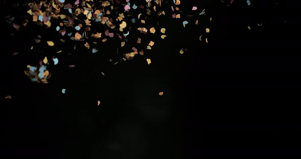 Confetti Falling against Black Background, Slow Motion 4K
