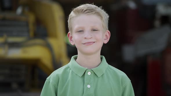 Slow motion push of boy smiling with cleft lip.