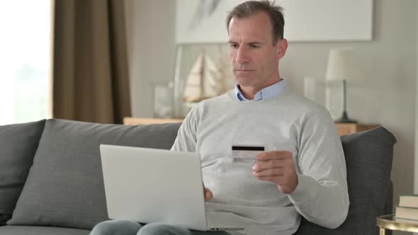 Attractive Businessman Successful at Online Payment on Smartphone