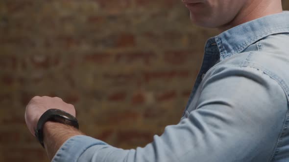 Man checking smartwatch