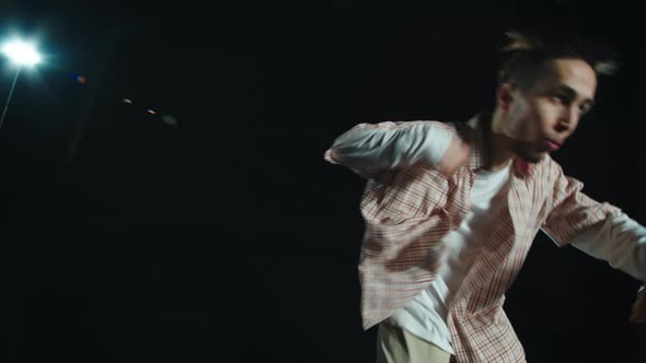 A Man Dances Hiphop on Stage