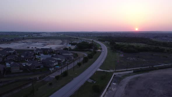 Flying into the sunset over developing neighborhoods.