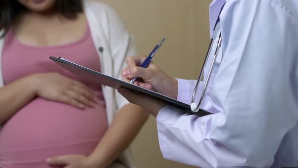 Pregnant Woman and Gynecologist Doctor at Hospital