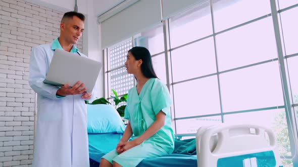 Doctor in Professional Uniform Examining Patient at Hospital