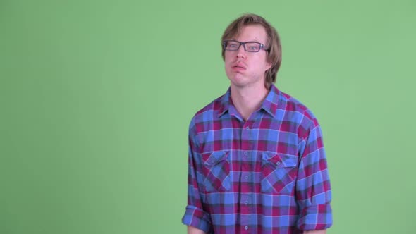 Stressed Young Hipster Man Looking Bored and Tired