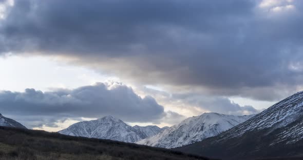 Timelapse of Epic Clouds at Mountain Medow at Autumn Time, Wild Endless Nature with Snow Storm Sky