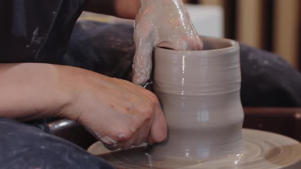 Pottery  Pulling Up a Piece of Clay on a Pottery Wheel