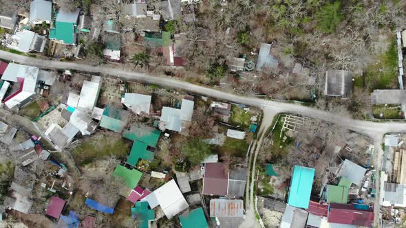 Flying over the village in the mountains.