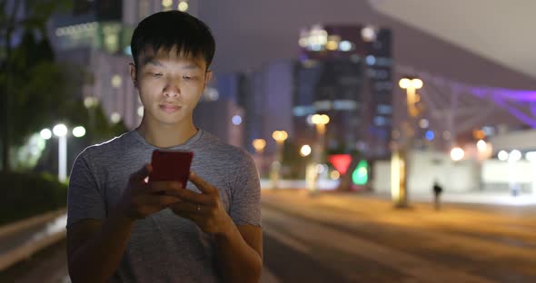 Man use of smart phone at night