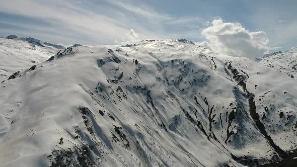 Aerial video of the Swiss Alps from Andermatt, Switzerland during winter (2)