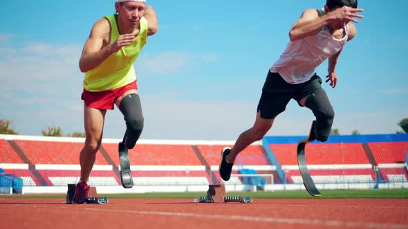 Male Paralympians Start Jogging at the Stadium